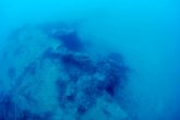 The aircraft upside down on the seabed.