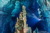 A big part of the cave is brighten up. At first plan, the huge stalagmite.  Wetklik.gr (Underwater Photography by Milonakis Κostas)