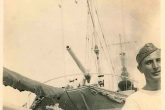 Sailors in the stern of ALTAIR torpedo boat under the 100 mm guns.